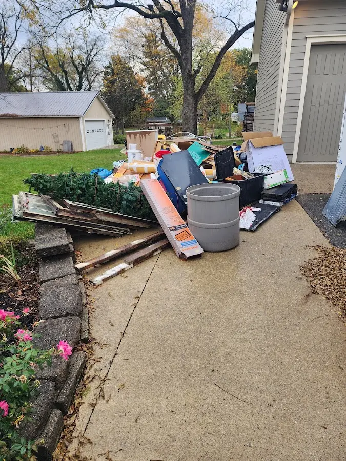 Dumpster being loaded with debris for Commercial Dumpster Rental in McMinnville
